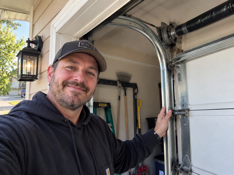 David T. beside his garage door following cable and track repair